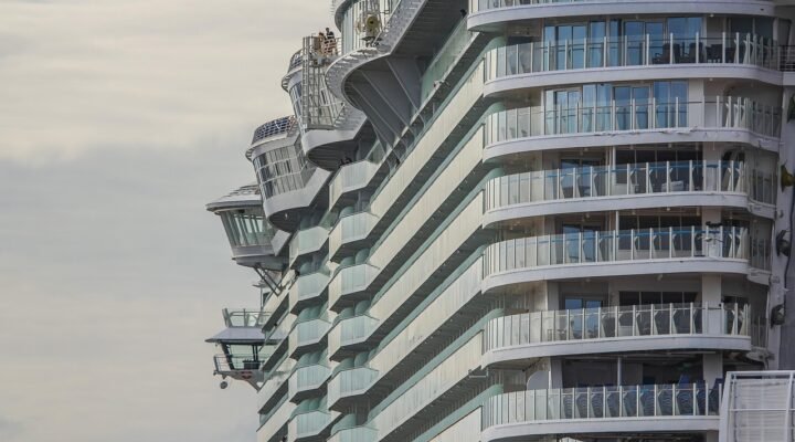 Professional chauffeur meeting passengers at Heathrow for a Southampton cruise transfer